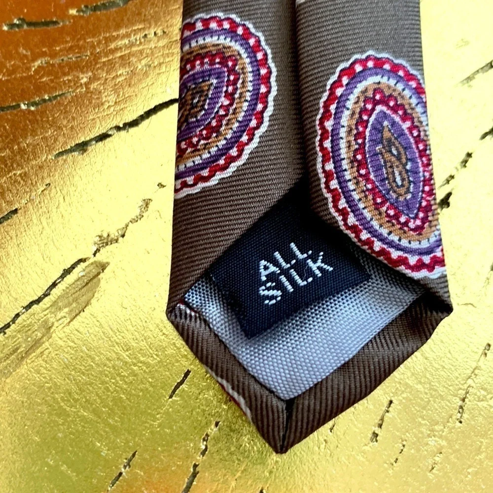 Alexander Cross Ltd Men’s Tie. 100% Silk. Base is Brown with Red & Blue Paisley